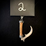 Item 2. Sickle pendant