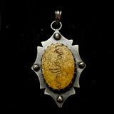 Item 20. Human skull cap pendant