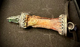 Item 5. Human finger vivianite pendant