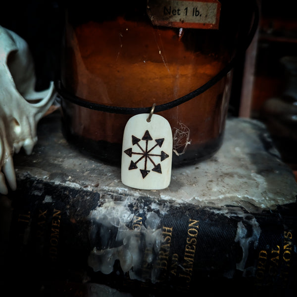 Chaos star burnt onto human bone necklace (made to order)