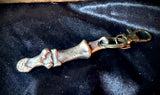Item 16. Bronze human finger keyring
