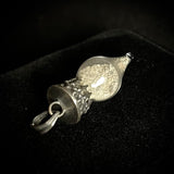 Item 21. Human cremains vial pendant