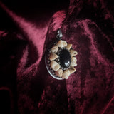 Human Teeth and Onyx Pendant