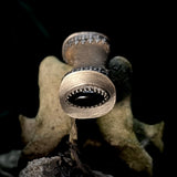 Finger bone pendant with onyx eye