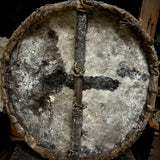 African tribal human skull on a shield