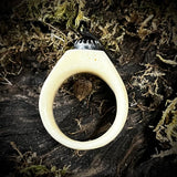 Carved human femur ring