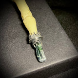 Item 3. Human finger vivianite pendant