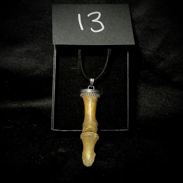 Item 13. Double finger bone pendant