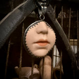 Doll face pendant