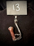 Item 13. Crows foot & finger pendant