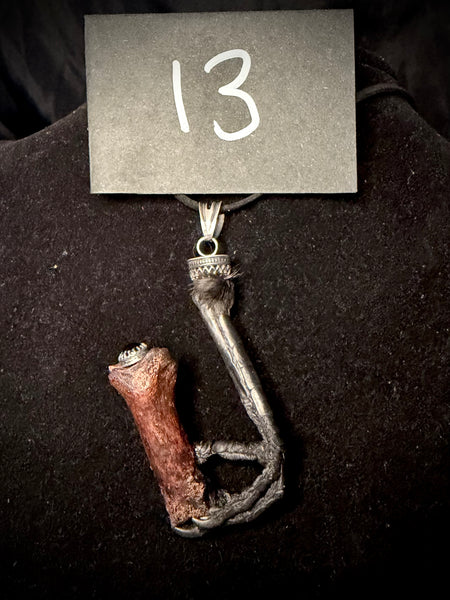 Item 13. Crows foot & finger pendant