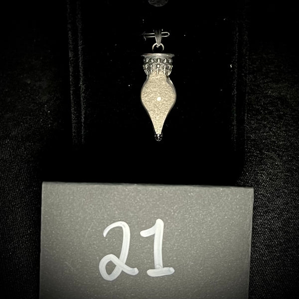 Item 21. Human cremains vial pendant