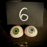 Item 6. Two vintage glass eyes