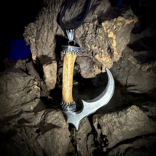 Silver scythe finger pendant