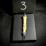 Item 3. Human finger vivianite pendant