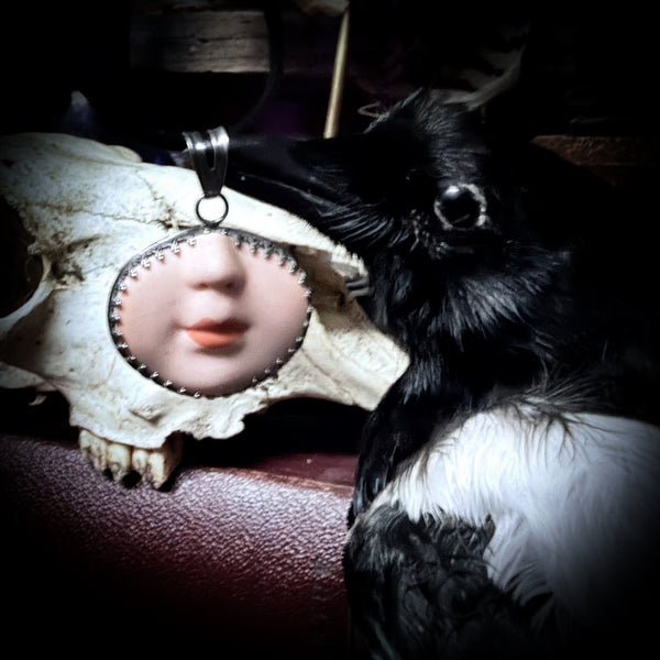 Doll face pendant