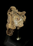 Item 18. Mummified arm slice stand