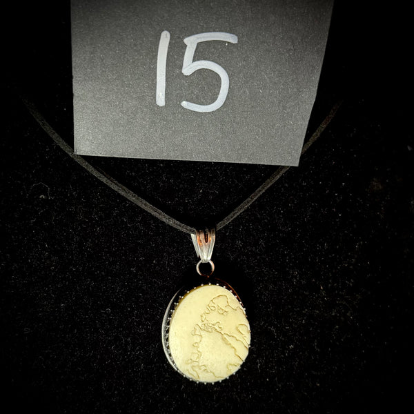 Item 15. Skull cap suture pendant