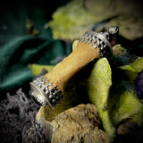 Finger bone pendant with onyx eye