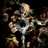 Silver key human femur pendant