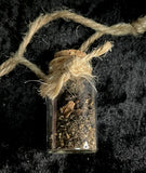 Human brain embroidery with mummified brain vial