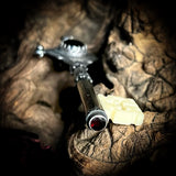 Silver key human femur pendant