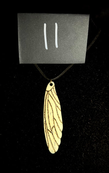Item 11. Femur wing pendant