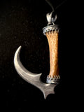 Item 2. Sickle pendant