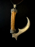 Item 2. Sickle pendant