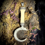 Silver sickle finger pendant