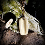 Stave carved femur necklace