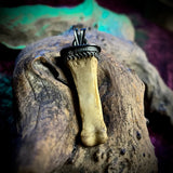 Human toe bone pendant