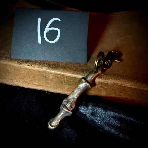 Item 16. Bronze human finger keyring