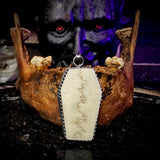 Skull cap coffin pendant
