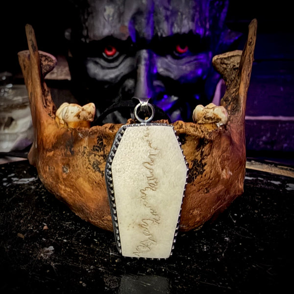 Skull cap coffin pendant