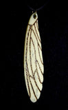 Item 11. Femur wing pendant
