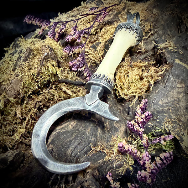Silver sickle finger pendant