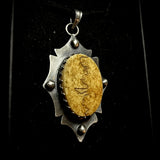 Item 20. Human skull cap pendant