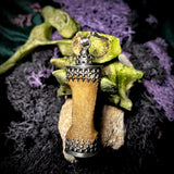 Finger bone pendant with onyx eye