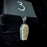 Item 3. Skull cap coffin pendant