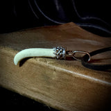 Item 14. Femur claw pendant