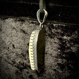 Item 3. Skull cap coffin pendant