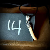 Item 14. Femur claw pendant