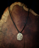 Pentagram symbol burnt onto human bone necklace