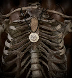 Vegvisir burnt onto human bone necklace